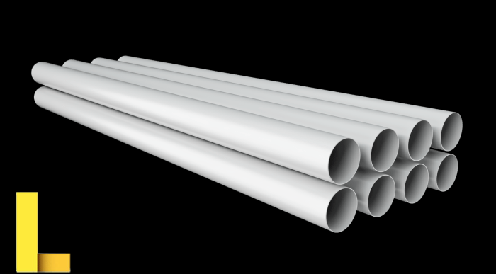 PVC pipes stacked in warehouse. A series of white tubes on black ...